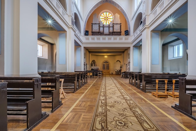 Radun belarus may 2021 interior of old baroque catholic church\
with frescoes icons paintings columns ceiling and vaulting