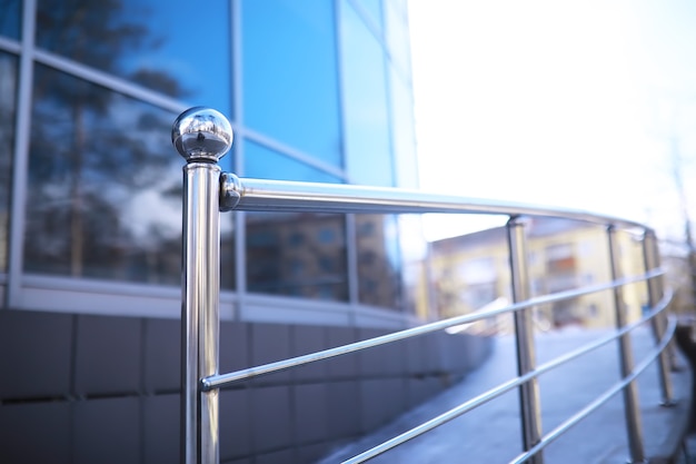 Railing made of glass and stainless steel. Stairs in modern interior. glass railing. Low Angle View Of Stairs Leading Towards modern building.