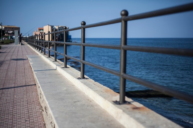 Railing on the sea at Porticello in Sicily