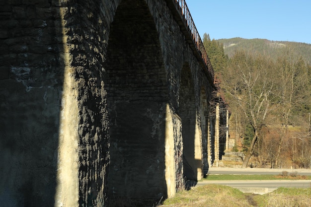Railroad bridge in Ukrainian Carpathian mountains in sunny day