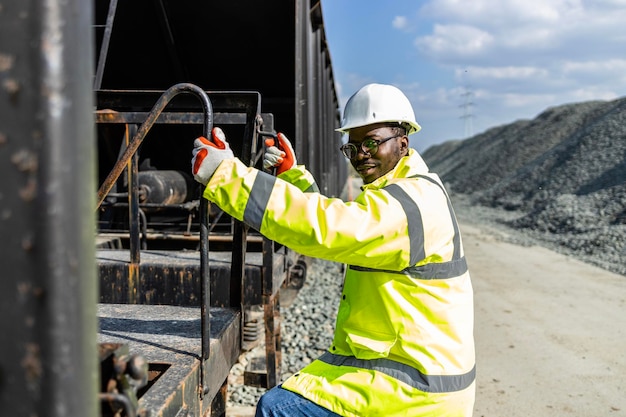 Railroad cargo worker checking train before departure