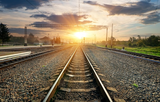 Railroad and small station at the sunset