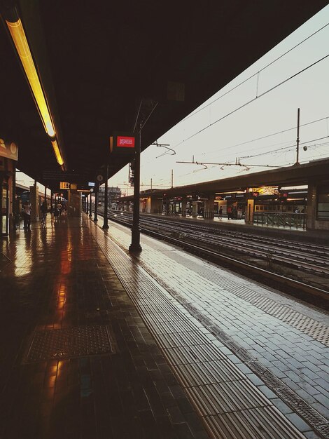 Railroad station against sky at night