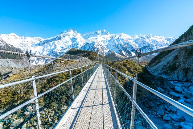 Railroad track passing through snow covered mountain