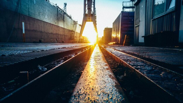 Railroad tracks in city during winter