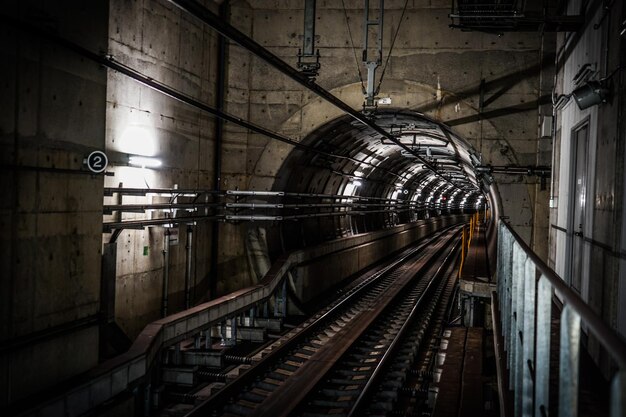 Photo railroad tracks in subway station