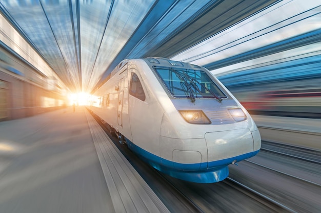 Railroad travel passenger train with motion blur effect, concept tourism.