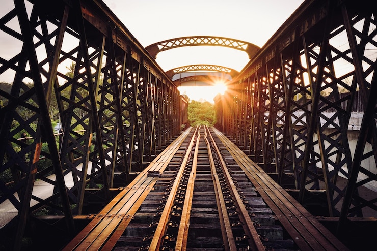 Photo railway bridge against sky during sunset