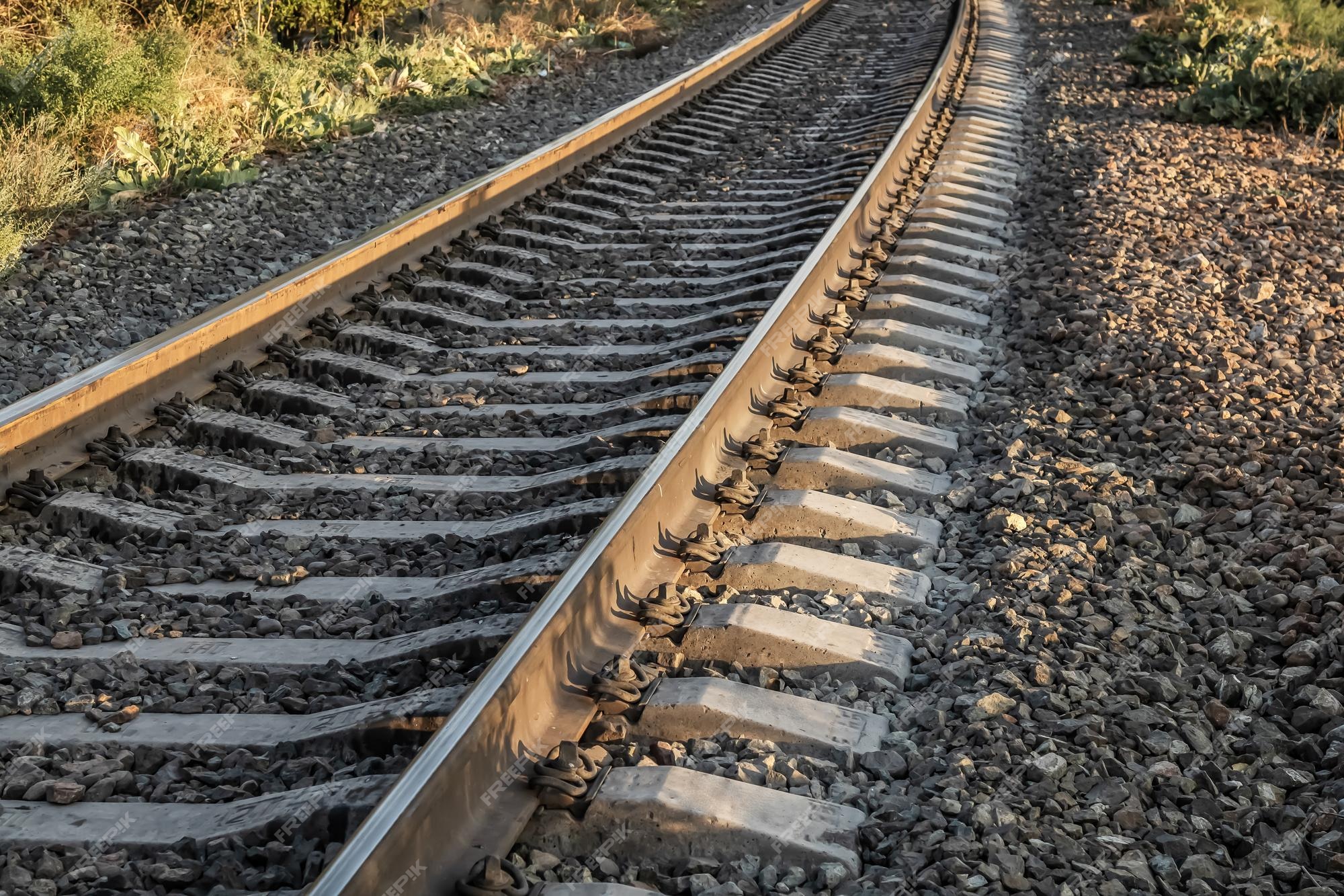 Arrow Rails. Rail and concrete sleepers closeup Stock Photo - Alamy