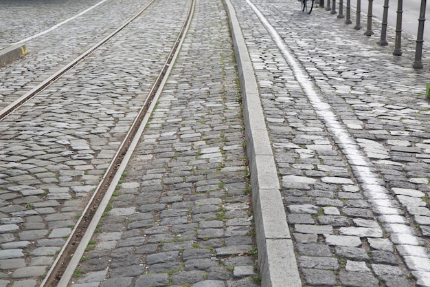 Railway Track and Cyclist on Cobblestones, Frankfurt, Germany