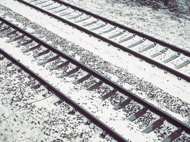 Railway tracks fragment covered by fresh snow