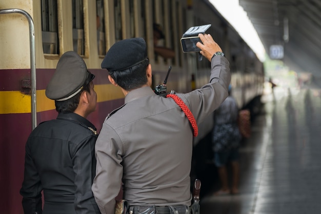 Railway train on the railroad tracks in Bangkok station