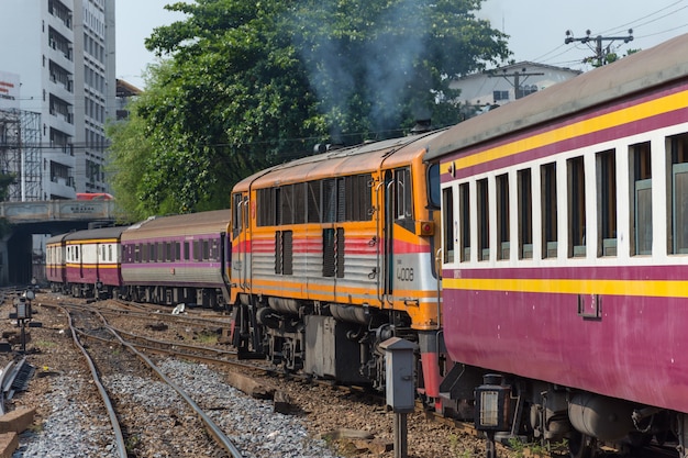 Railway train on the railroad tracks in Bangkok