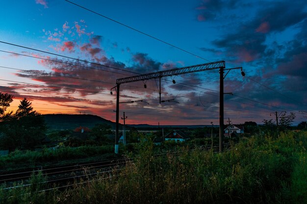 Railway in the village during sunset