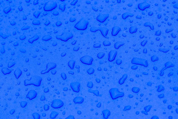 Rain drops on the dark blue floor