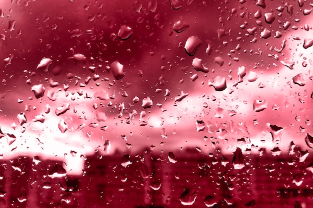 Rain drops on glass for red backgrounds rainy fall autumn weather