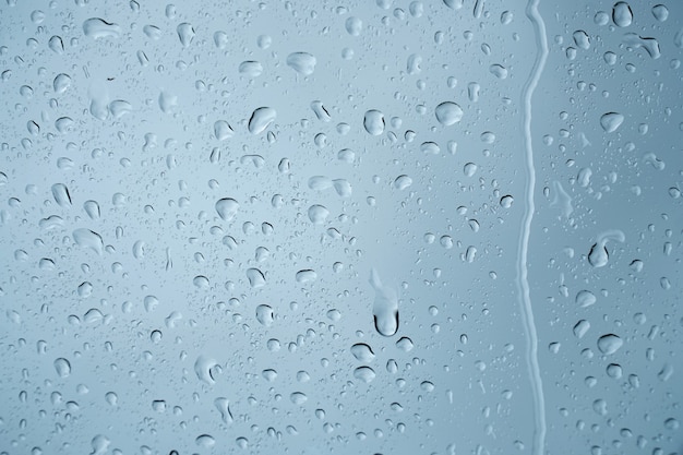 Rain drops on the glass surface.