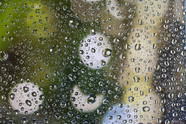 Rain drops on glass with a beautiful background