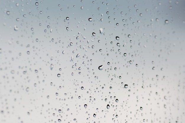 Rain drops on the window close up.