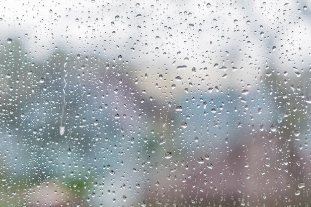 Rain drops on a window glass. Abstract texture. 