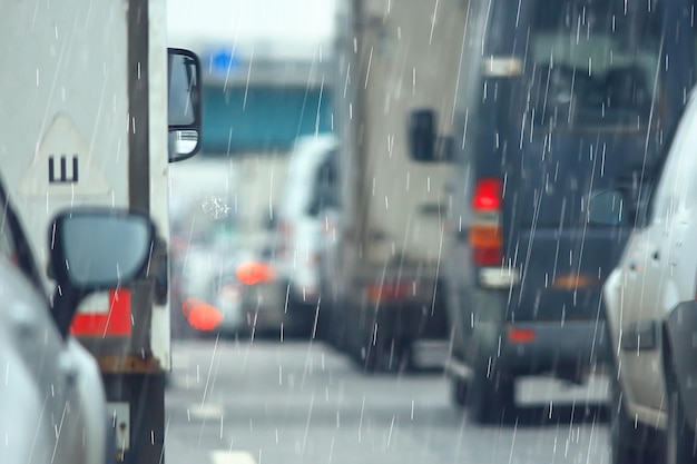 rain road traffic jam / abstract background raindrops in the city on the highway, cars stress autumn