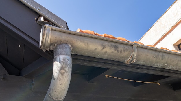 Rain siding gutters and soffit on roof facade home