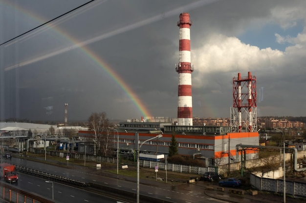 Rainbow after rain over the heating power plant