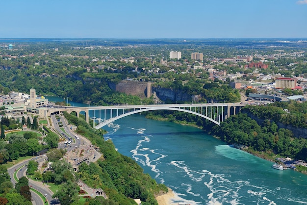 Rainbow Bridge over river with blue sky