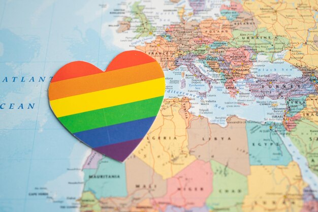 Rainbow color heart on world map background symbol of LGBT pride month celebrate annual in June