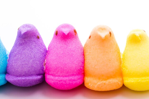 Rainbow color marshmallow peeps and jelly beans.