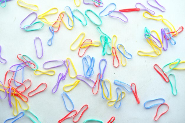 Rainbow color Rubber bands on color background