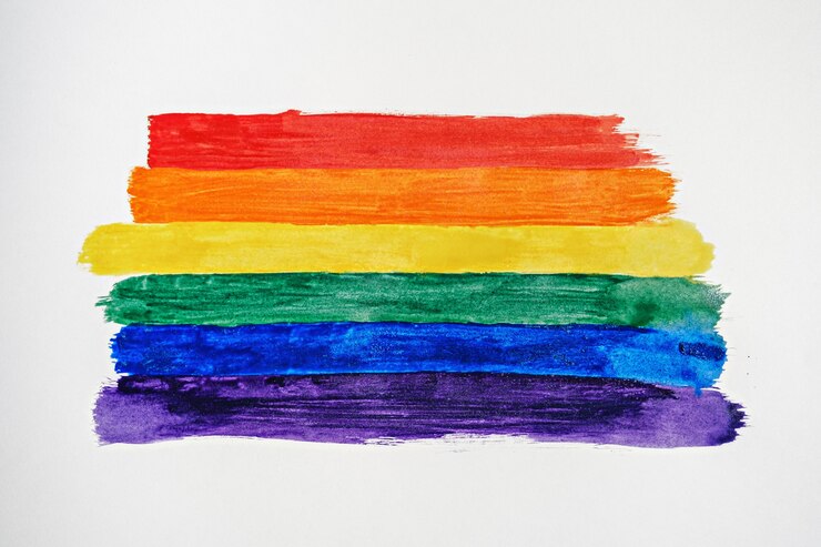 Photo rainbow color stripes symbol of lgbtq gay pride, top view, lgbt flag drawn strokes on white background, concept