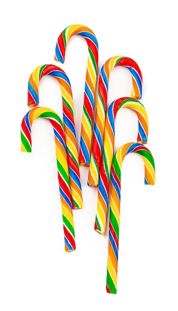 Rainbow colored candy cane isolated on white 