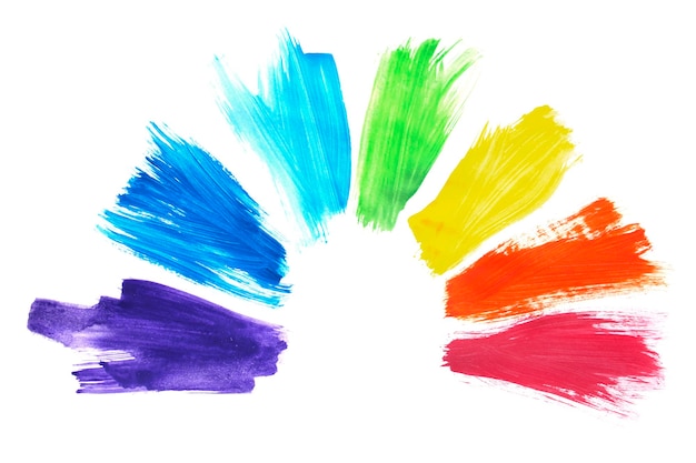 Rainbow colored paint brush strokes isolated over white