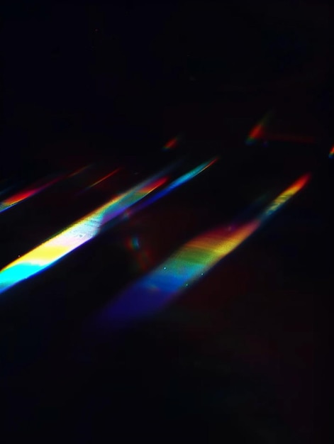 a rainbow colored reflection on a keyboard and the light reflecting on the glass