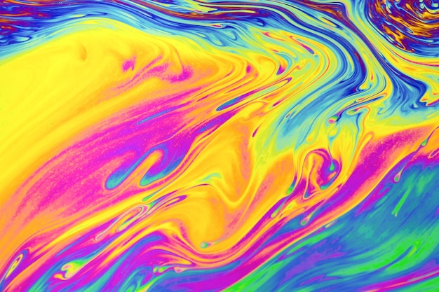 Rainbow colors Psychedelic multi colored patterns background Photo macro shot of soap bubbles
