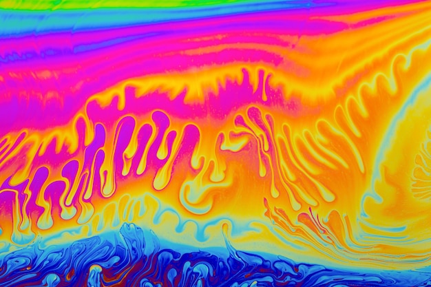 Photo rainbow colors psychedelic multi colored patterns background photo macro shot of soap bubbles