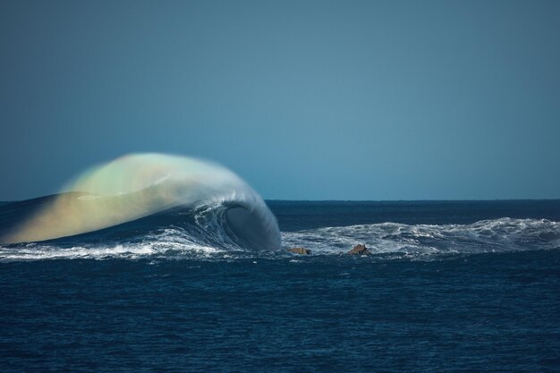 Photo rainbow created by a monster wave