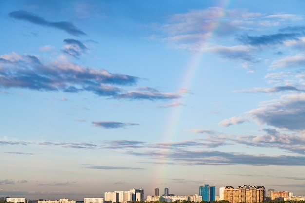 Rainbow in evening sky over residential district