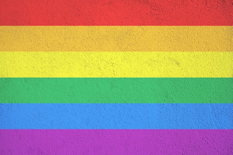Photo rainbow flag grunge background, commonly known as the gay pride flag or lgbtq pride flag