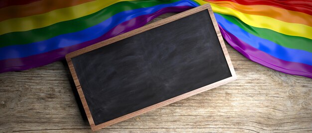 Rainbow flag placed on wooden background Blackboard in frame with copyspace 3d illustration