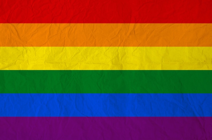 Photo rainbow flag on vintage paper texture background