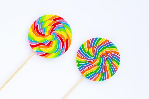 Rainbow lollipop on white background