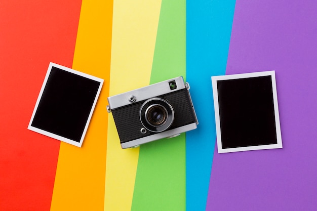 Rainbow pride flag with retro camera and photos