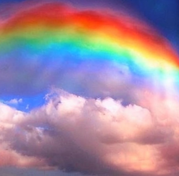 Photo rainbow wallpaper with clouds photo ai generated