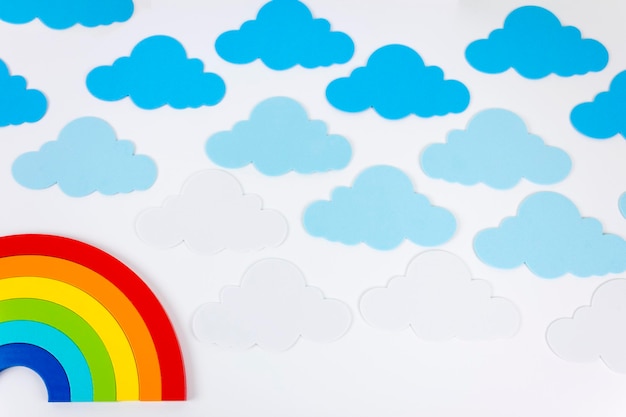 Rainbow with clouds on a white background Flat lay Copy space