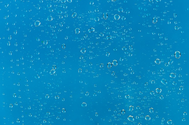 Raindrops on blue background