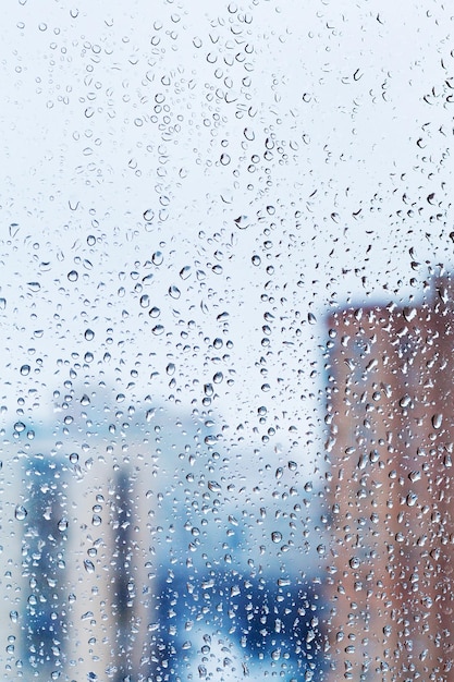 Raindrops on home glass window