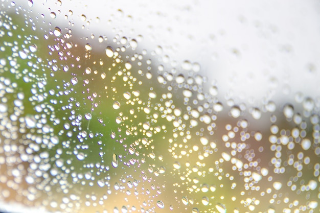 Raindrops on window glass, background