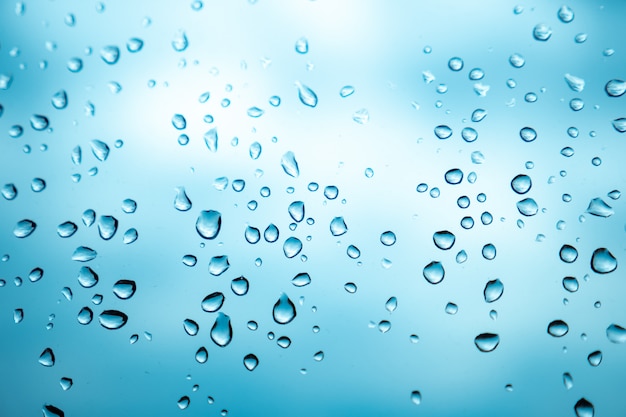 Raindrops on the window glass on a cloudy day